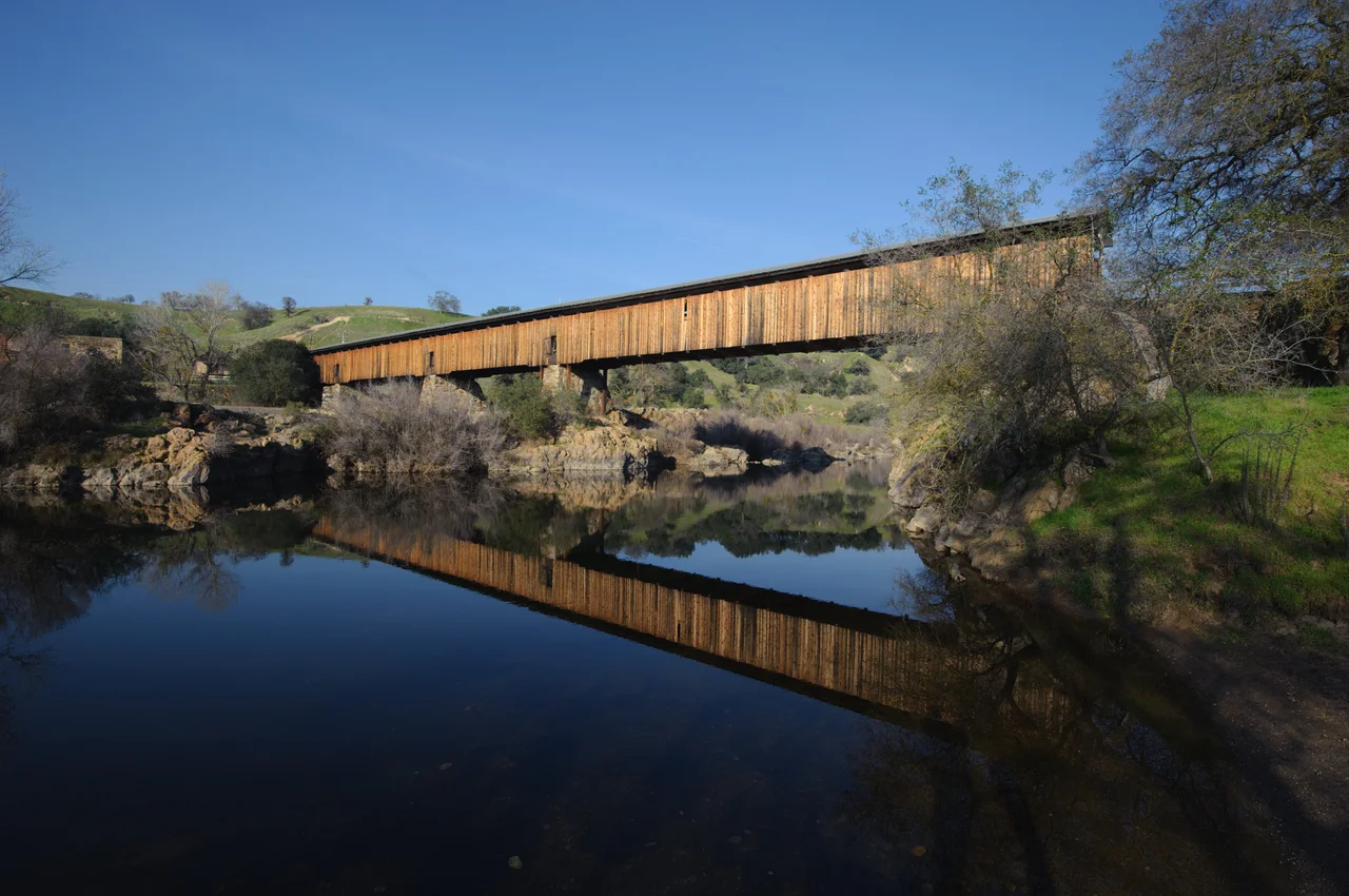 Knights Ferry covered bridge — crossing the Stanislaus River in Knights Ferry, California.
The longest covered bridge west of the Mississippi River, at 330 feet (100 m) in length.
A California Historical Landmark, and a Knights Ferry Historic District contributing property on the National Register of Historic Places.