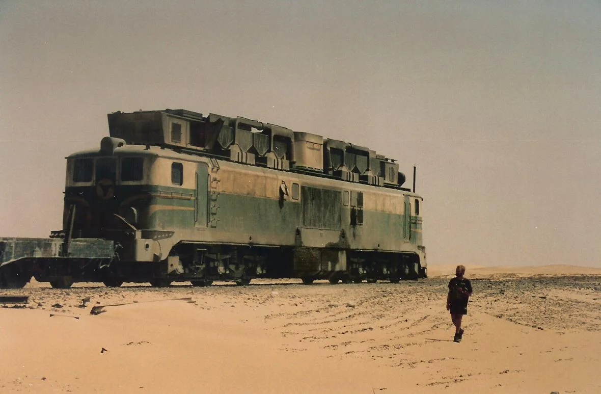 SNIM Alsthom locomotive no CC05, on the Mauritania Railway between Nouadhibou and Zouerate, northern Mauritania. The "skyline casing" on the locomotive's roof houses special filtration equipment, to deal with the sandy and dusty Saharan atmospheric conditions evident in this photo.