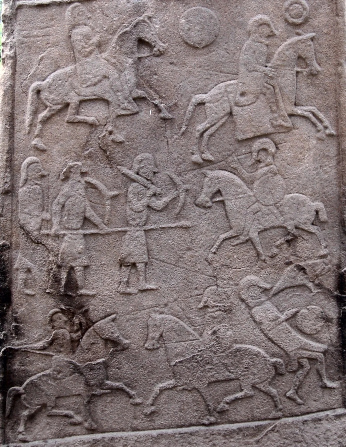 This image is a crop of a photograph of the Pictish stone in the churchyard at Aberlemno Parish Church (the stone is sometimes known as Aberlemno II). The battle scene depicted is generally accepted to be that of the Battle of Nechtansmere.